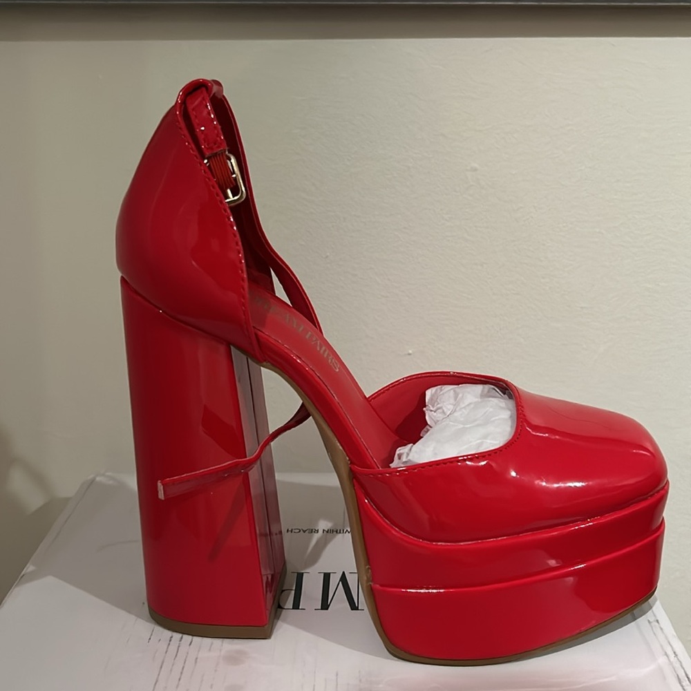 Red Platform Heels 
Size: 6.5 
Condition: GOOD (only worn once)
